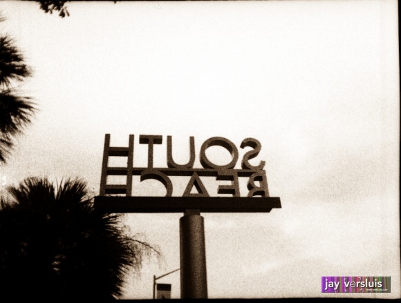 South Beach sign on a pole from behind